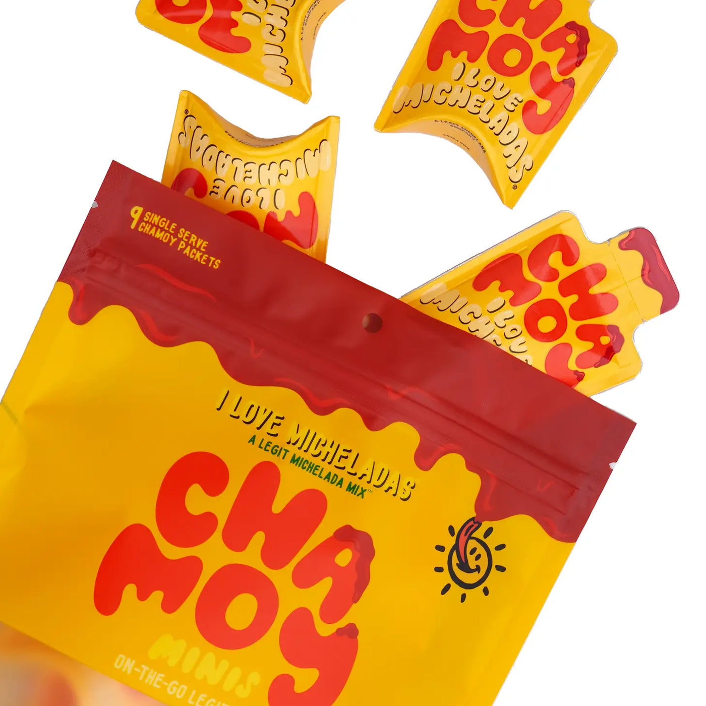 Opened back of Chamoy Minis with four to go packets spilling out of the bag. Features yellow and red branded packaging.