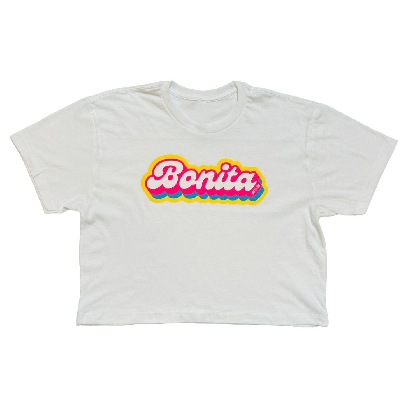 white crop top with the phrase Bonita in pink, yellow and blue lettering.