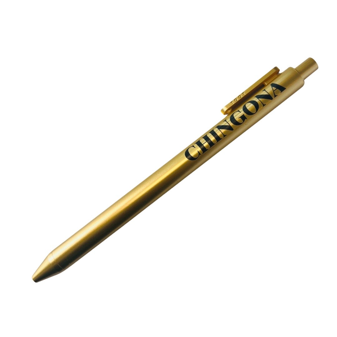 Gold pen with the word Chingona in Black lettering.