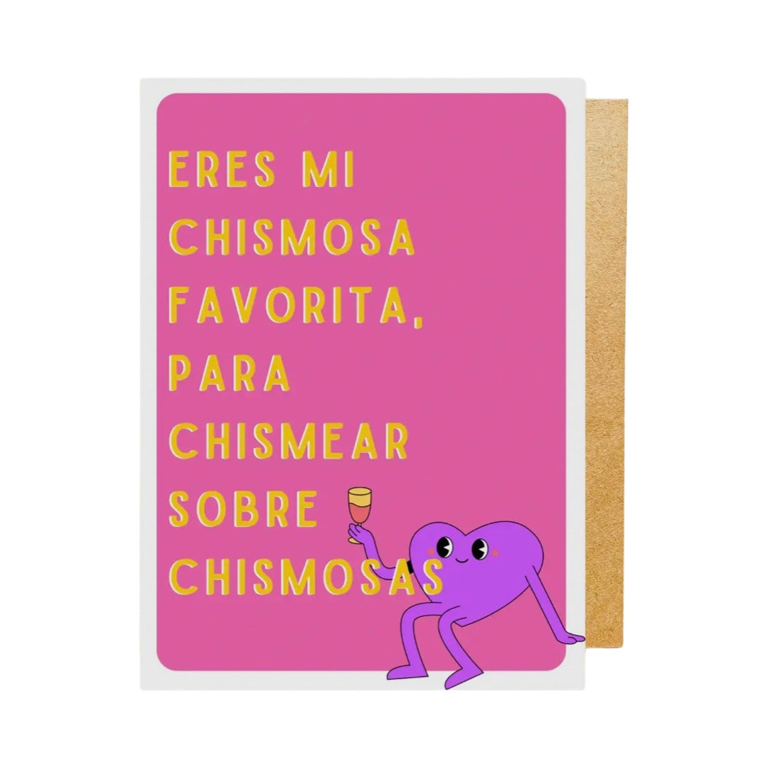 pink card with the phrase "eres mi favorita chismosa para chismear sobre chismosas" in yellow lettering featuring a heart holding a glass of wine. 