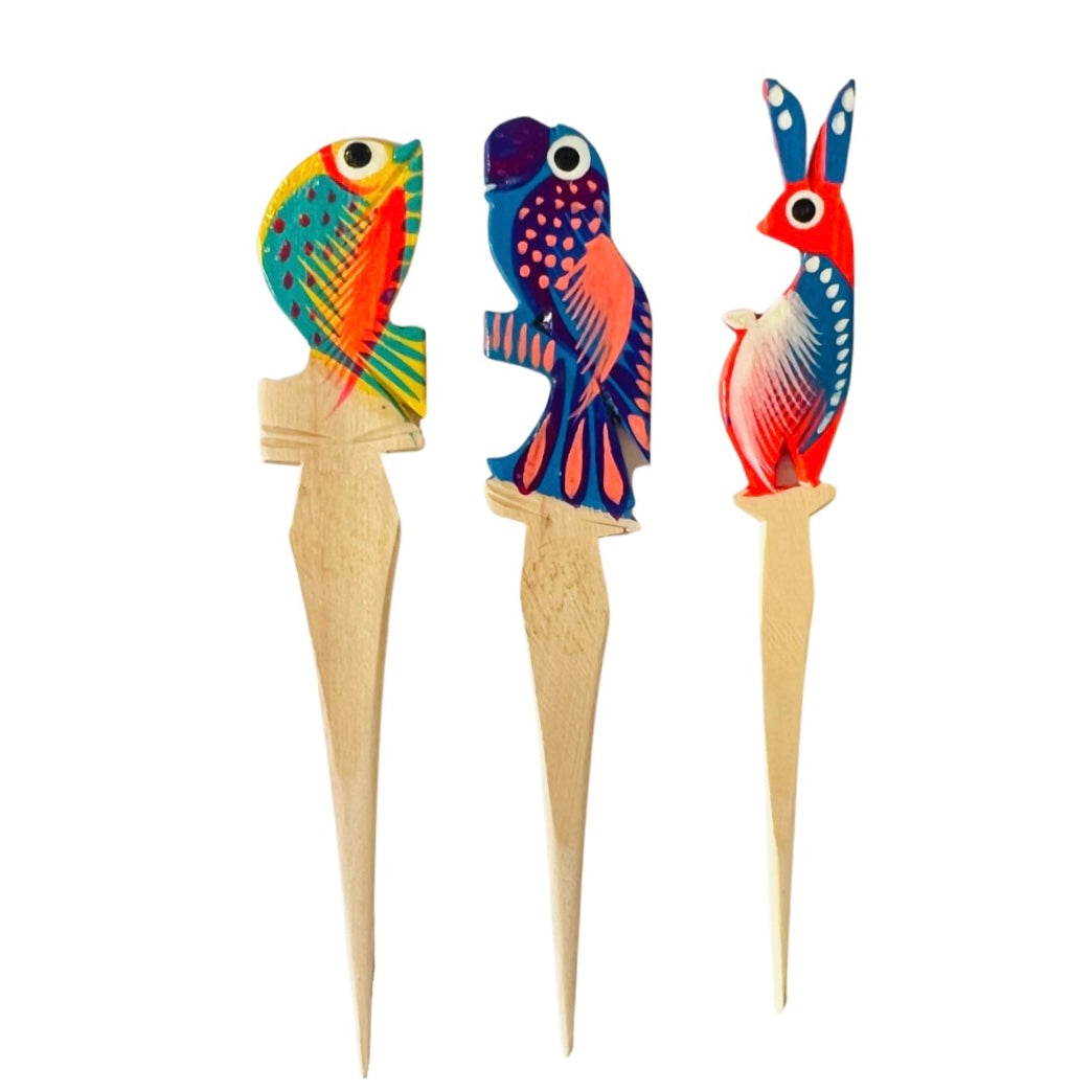 set of wooden toothpicks with a design of various animals painted on the top
