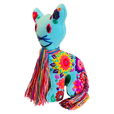 side view of an embroidered teal cat with colorful flowers