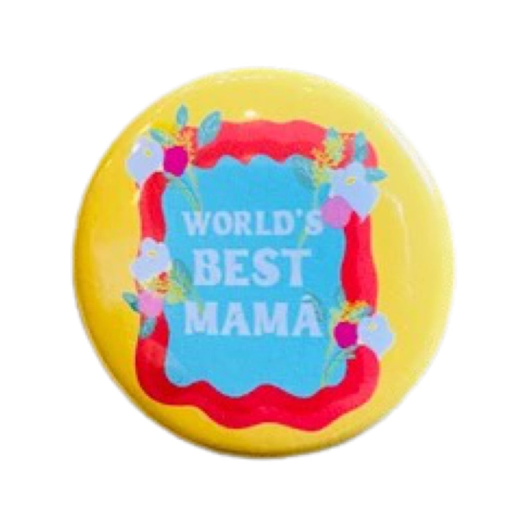 Yellow round pin button with a red frame and flowers surrounding the phrase World's Best Mama in white lettering