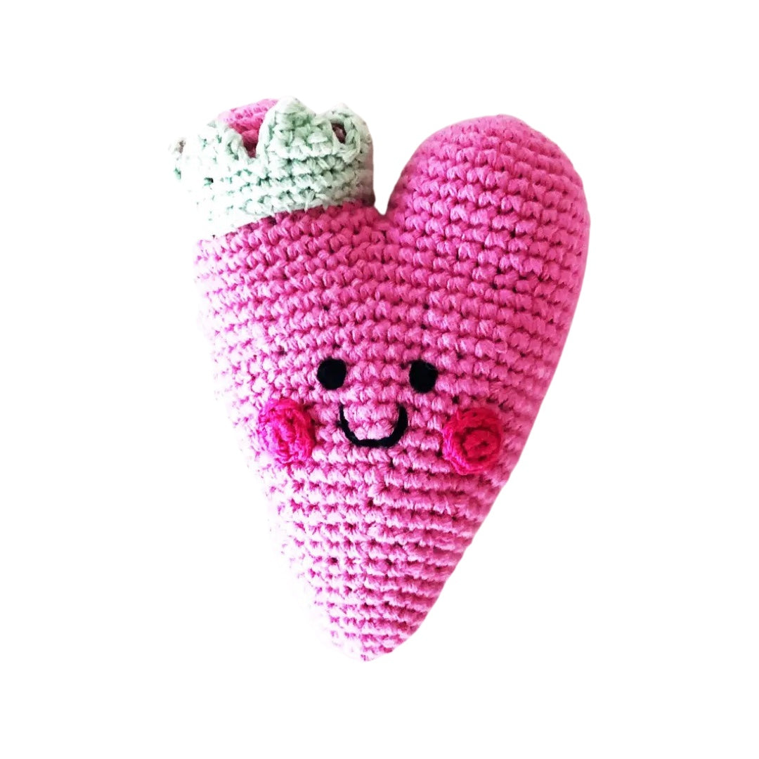 Pink crochet heart rattle featuring a crown and a smiley face.