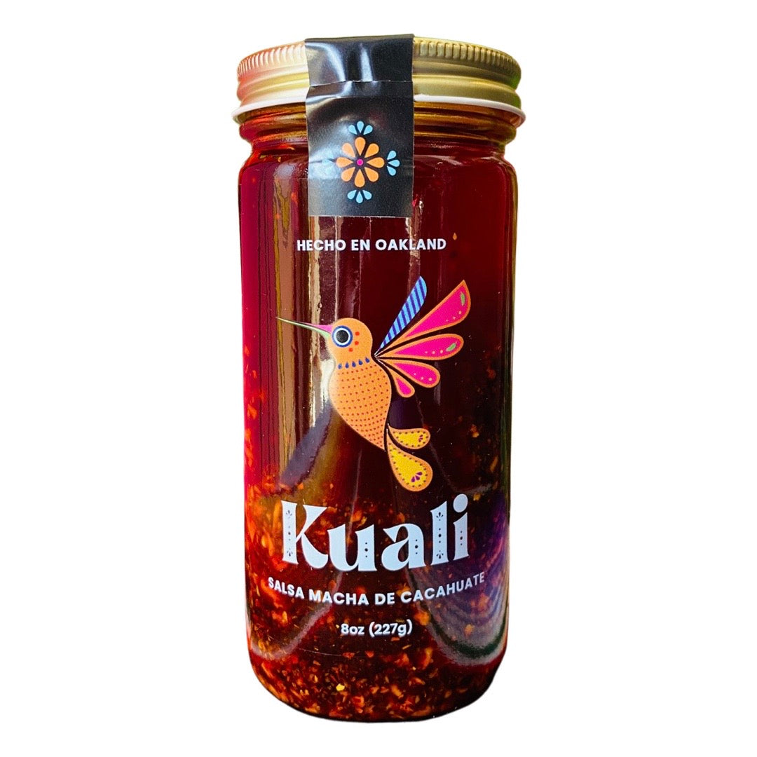 front view of Kuali Salsa - Macha de Cacahuate packaged in a clear glass branded bottle.