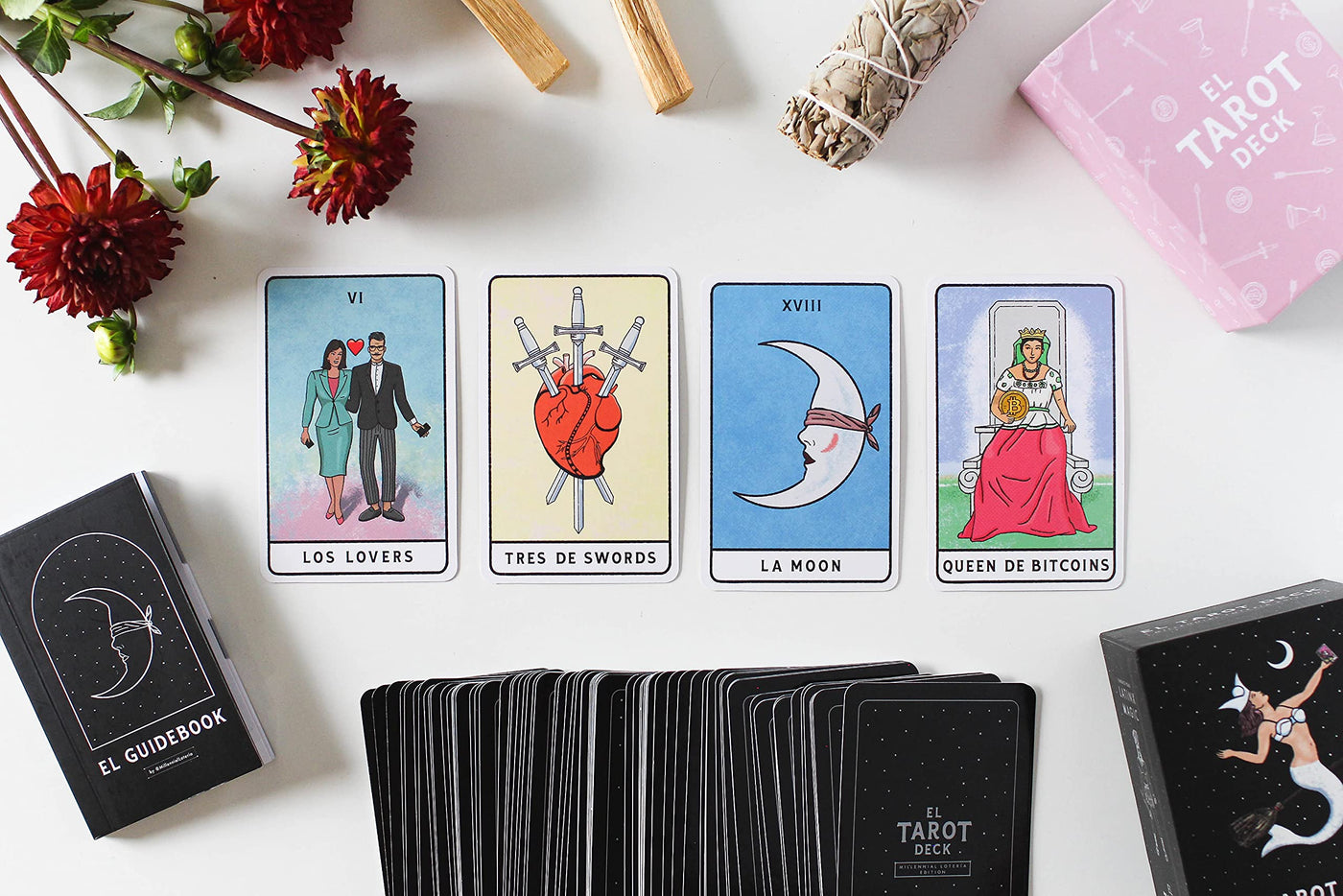 Photo of four tarot cards including "Los Lovers", "Tres de swords", "La Moon" and "Queen de Bitcoins"