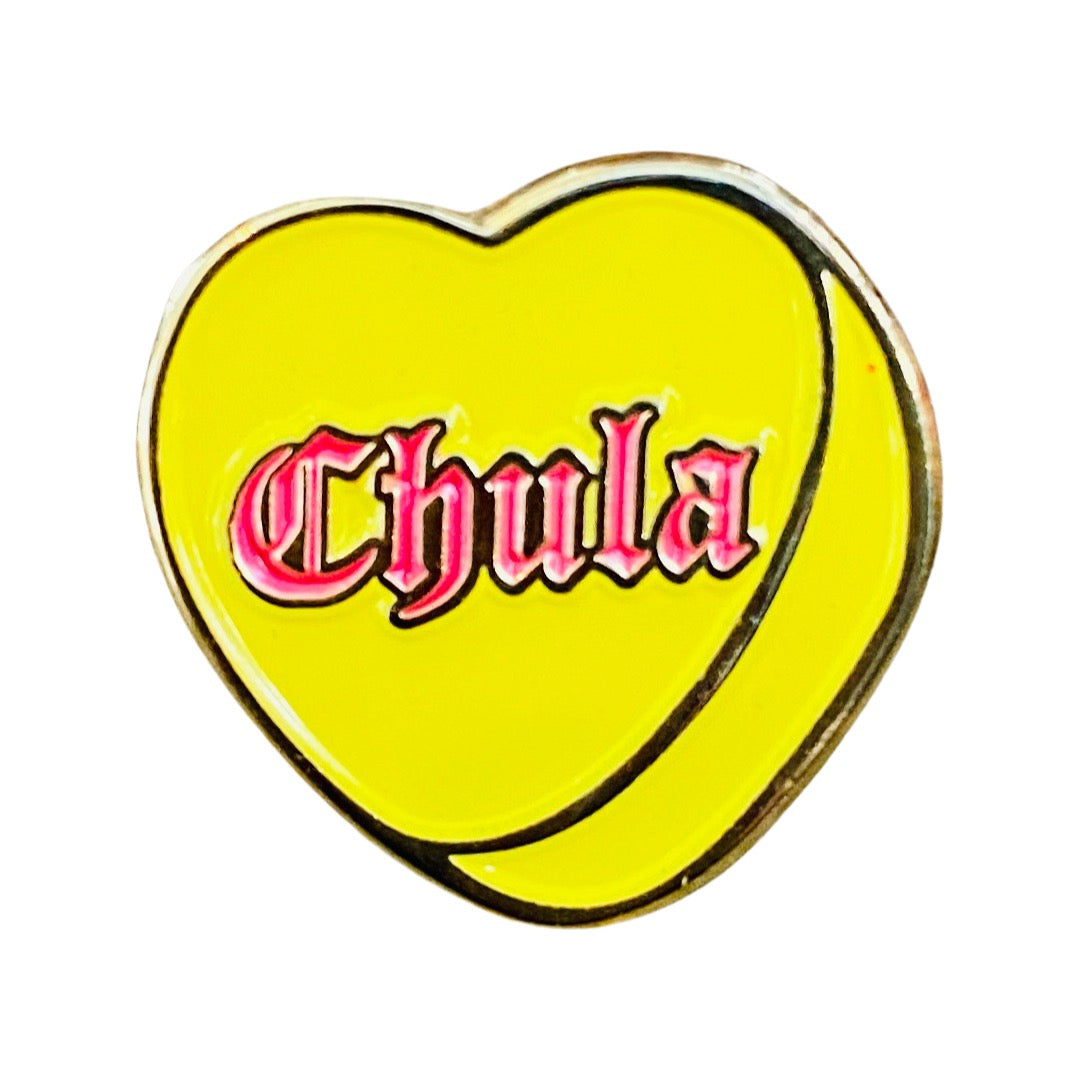 Yellow enamel heart pin with the phrase Chula in pink lettering