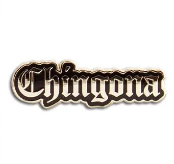 gold enamel pin of the word chingona outlined in black.