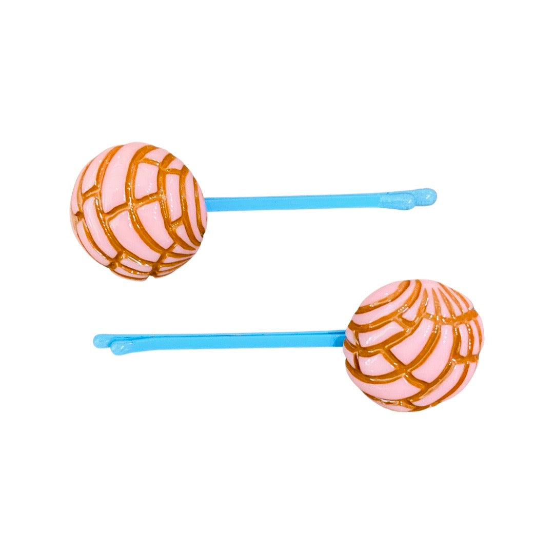 Pink concha (type of Mexican sweet bread) bobby pins. 
