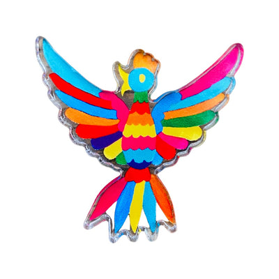 Clear enamel pin with a colorful otomi bird on it.