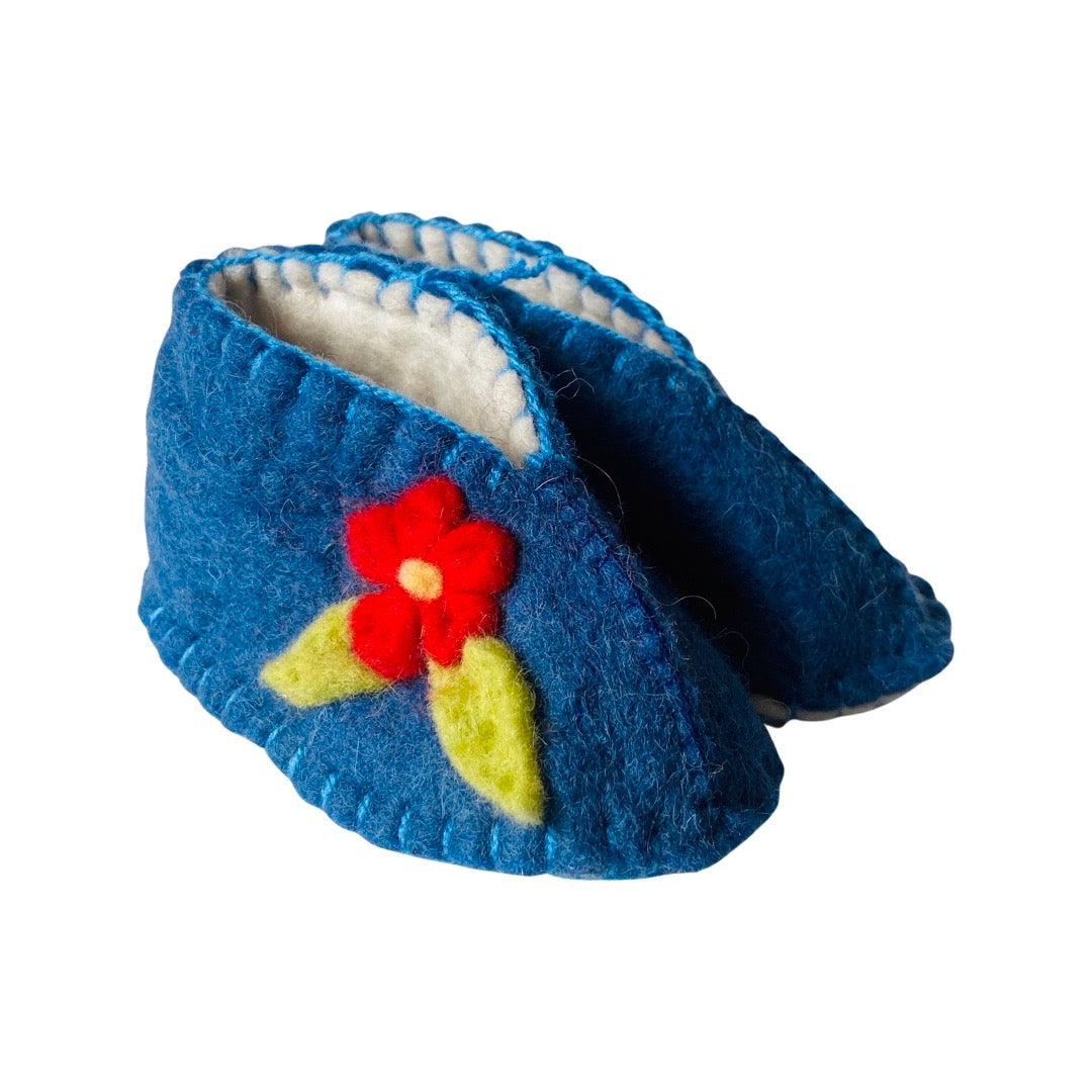Blue felt baby booties featuring a red flower with two leaves on the side