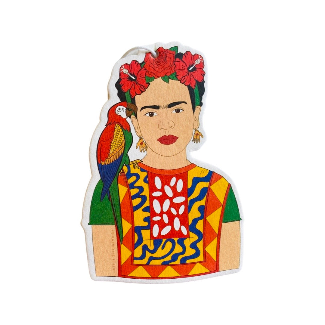 Frida Kahlo in a yellow embroidered top with a red flower crown and parrot on her shoulder as an air freshener.