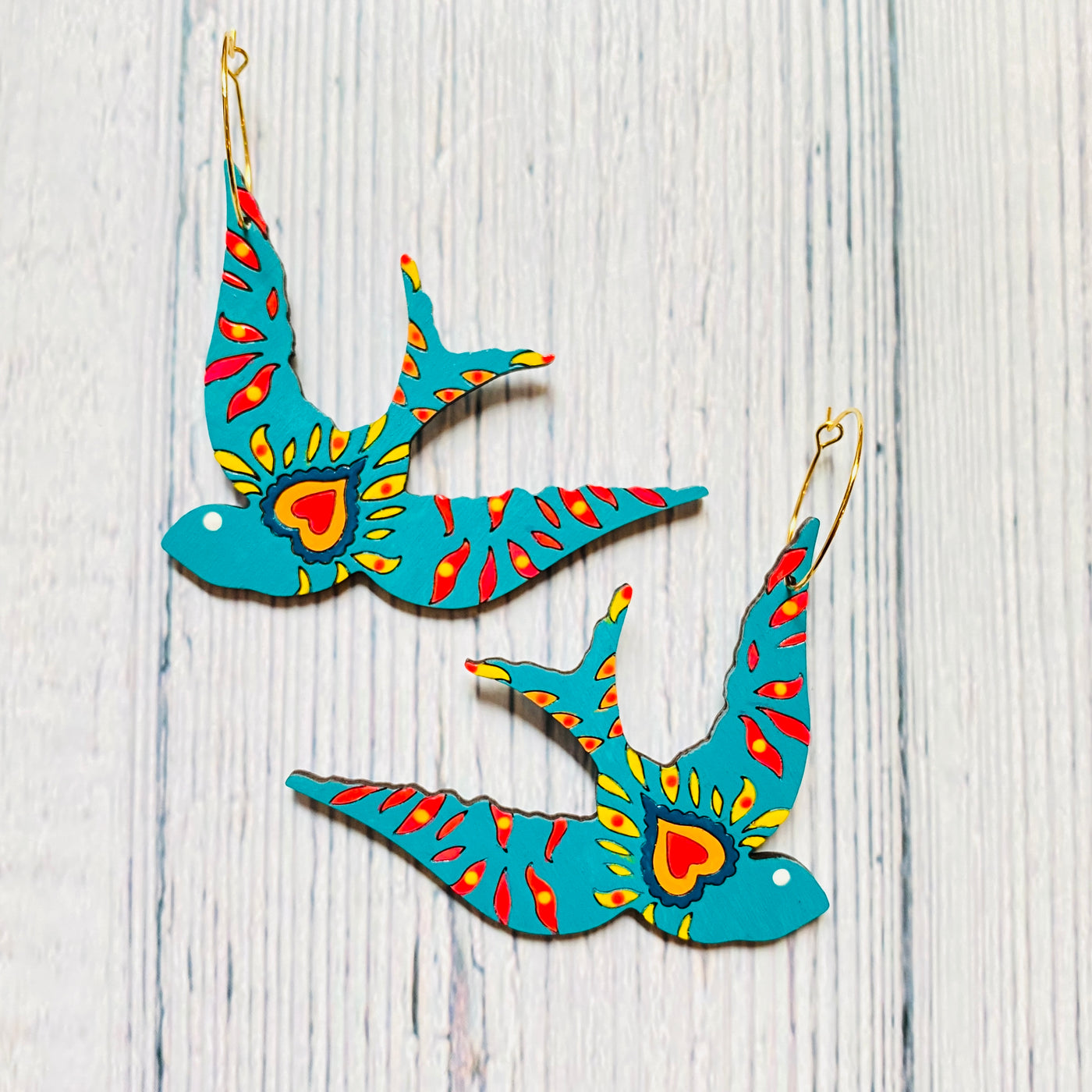 Golondrina bird turquoise wood hoop earrings with hand painted acrylic heart design.