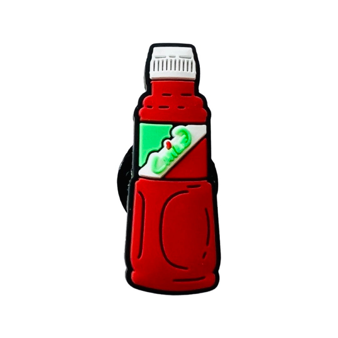 A single bottle of the Mexican chile powder called Tajin. Red bottle with a white lid and a red, white, green label with the word Chile in green.