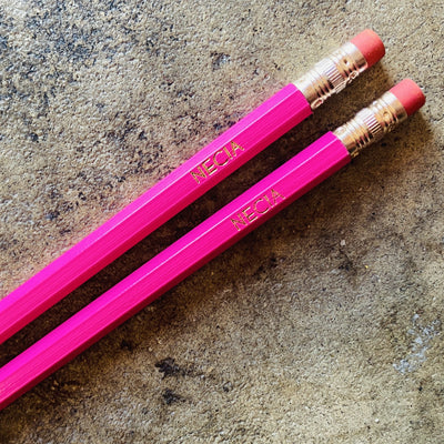 Top view of Necia phrase pencils in bright pink.