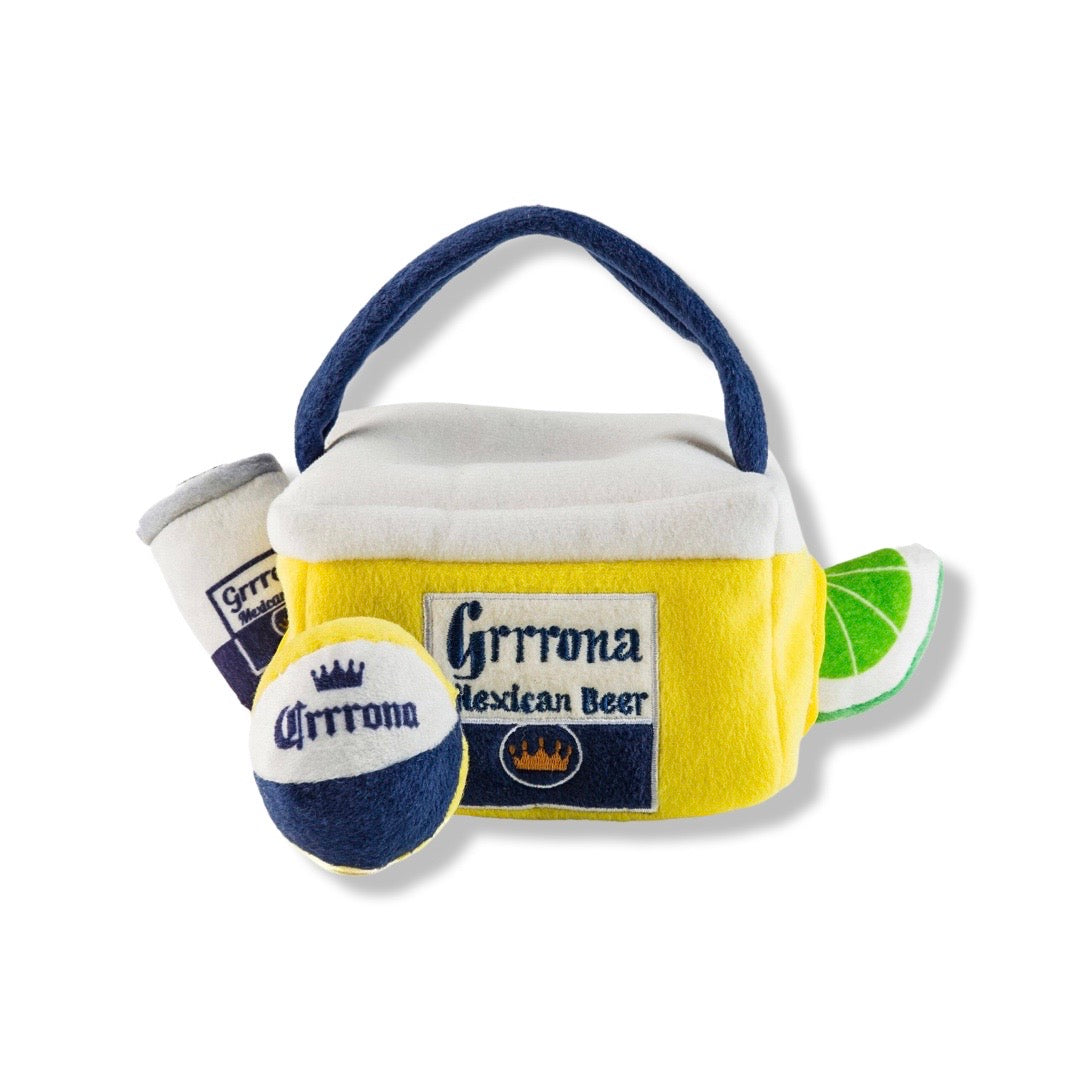 plush dog toy of a yellow and white cooler, beer can, beach ball and slice of lime. The cooler features the phrase Grrrona Mexican Beer
