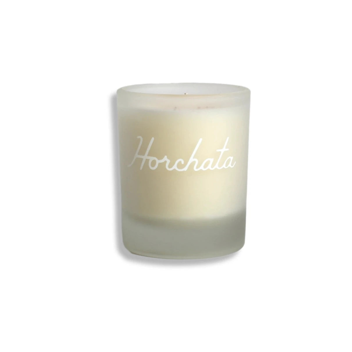 Small white horchata (cinnamon & vanilla) scented candle. Candle reads Horchata in cursive with white lettering. 