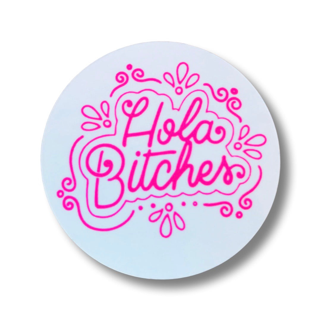 white round sticker with the phrase Hola Bitches in cursive and pink lettering