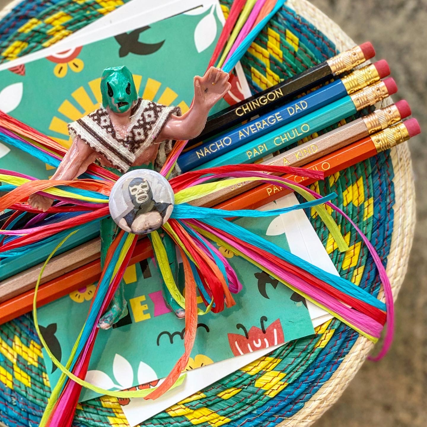 Photo of Luchador figurine, pencils, & tortilla basket