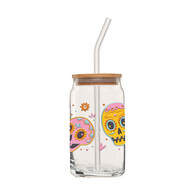 First side of clear glass can tumbler with a glass straw featuring two colorful sugar skulls, hearts and flowers.