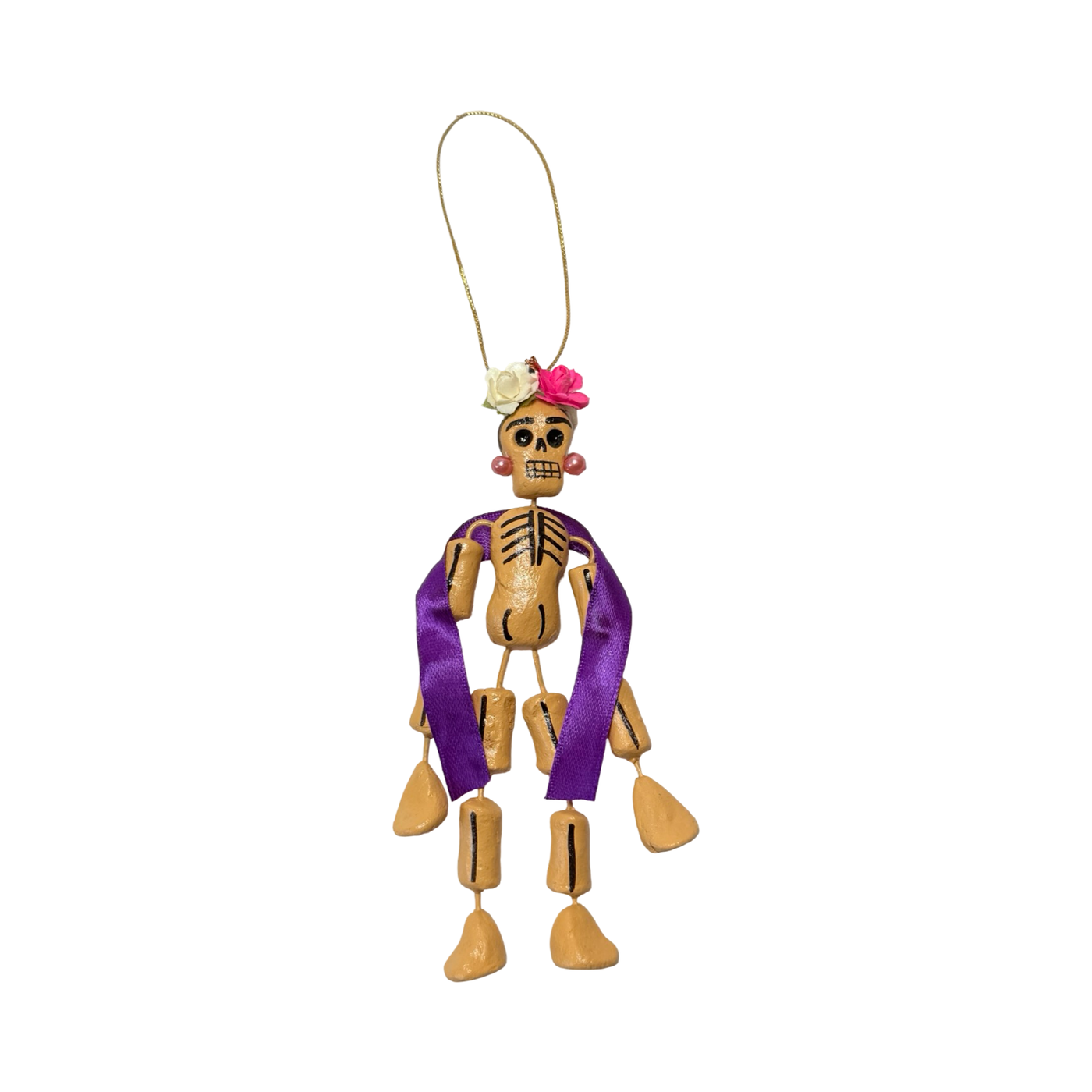 small Día de Muertos skeleton ornament with flowers, purple ribbon, and earrings.