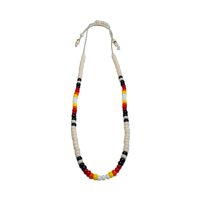 Vibrant Mexican bead bracelet featuring cream, red, black, yellow and white beads.