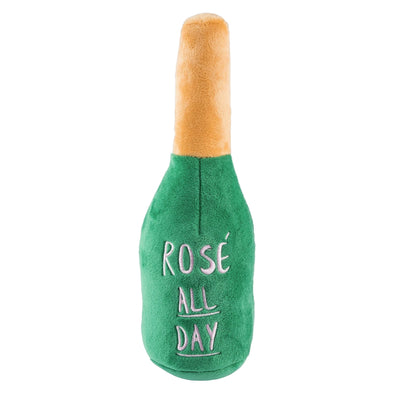Green plush dog toy in the shape of a champagne bottle featuring the phrase Rose All Day in white lettering