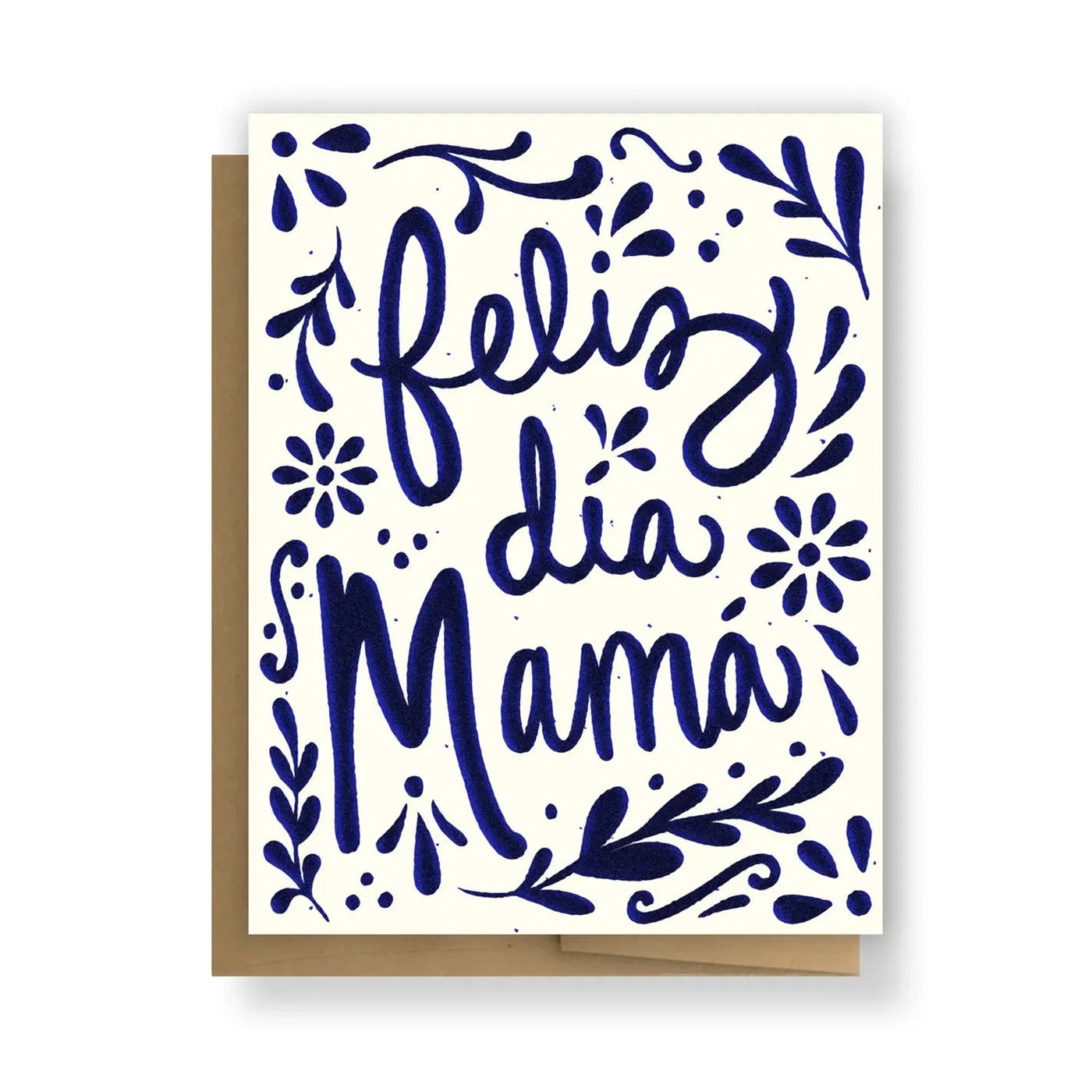 White card with blue floral and foliage designs featuring the phrase Feliz dia Mama in blue lettering.