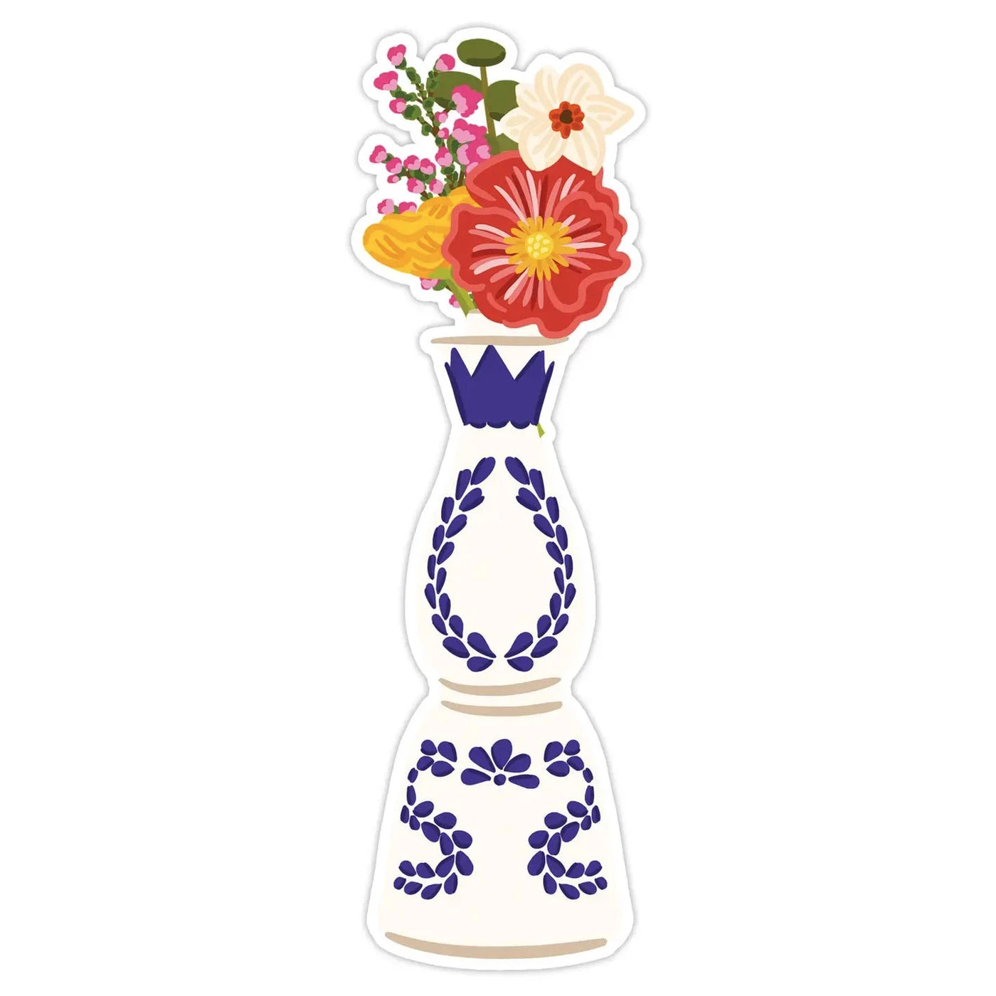 Blue and white tequila bottle used as a vase with a variety of colorful flowers 