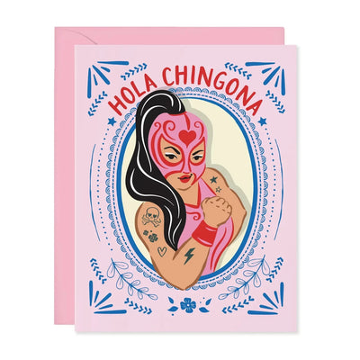 pink card with the image of a female luchadora in a pink outfit and mask with the phrase Hola Chingona in red lettering.
