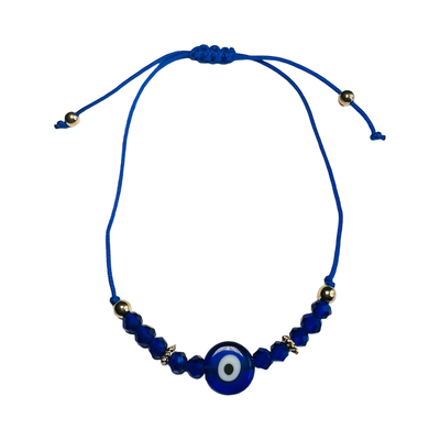 A blue beaded bracelet featuring a traditional Evil Eye charm, with an adjustable cord and gold accents