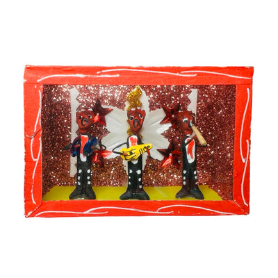 red nicho box that features a scene with devil figurines playing instruments