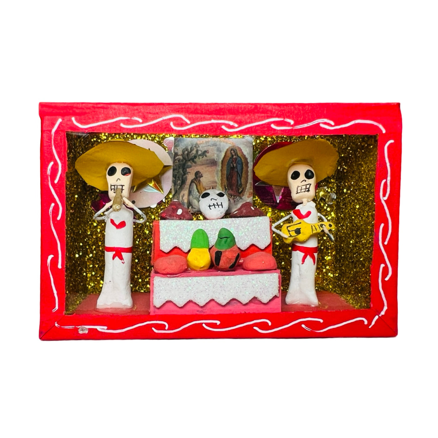 red nicho box that features a scene with skeletons and an altar