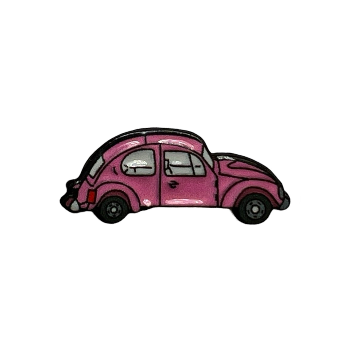 Mini enamel pin featuring a vibrant pink Volkswagen Beetle with black detailing, capturing a retro and whimsical design.