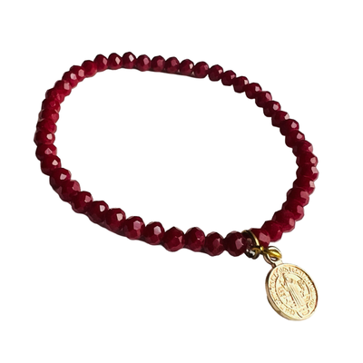 Burgundy bead bracelet with a gold charm