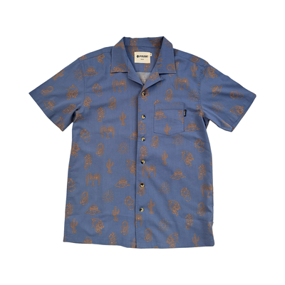 Blue short-sleeve button-down shirt with allover brown graphic prints including cacti, suns, roosters, and southwest-inspired designs.