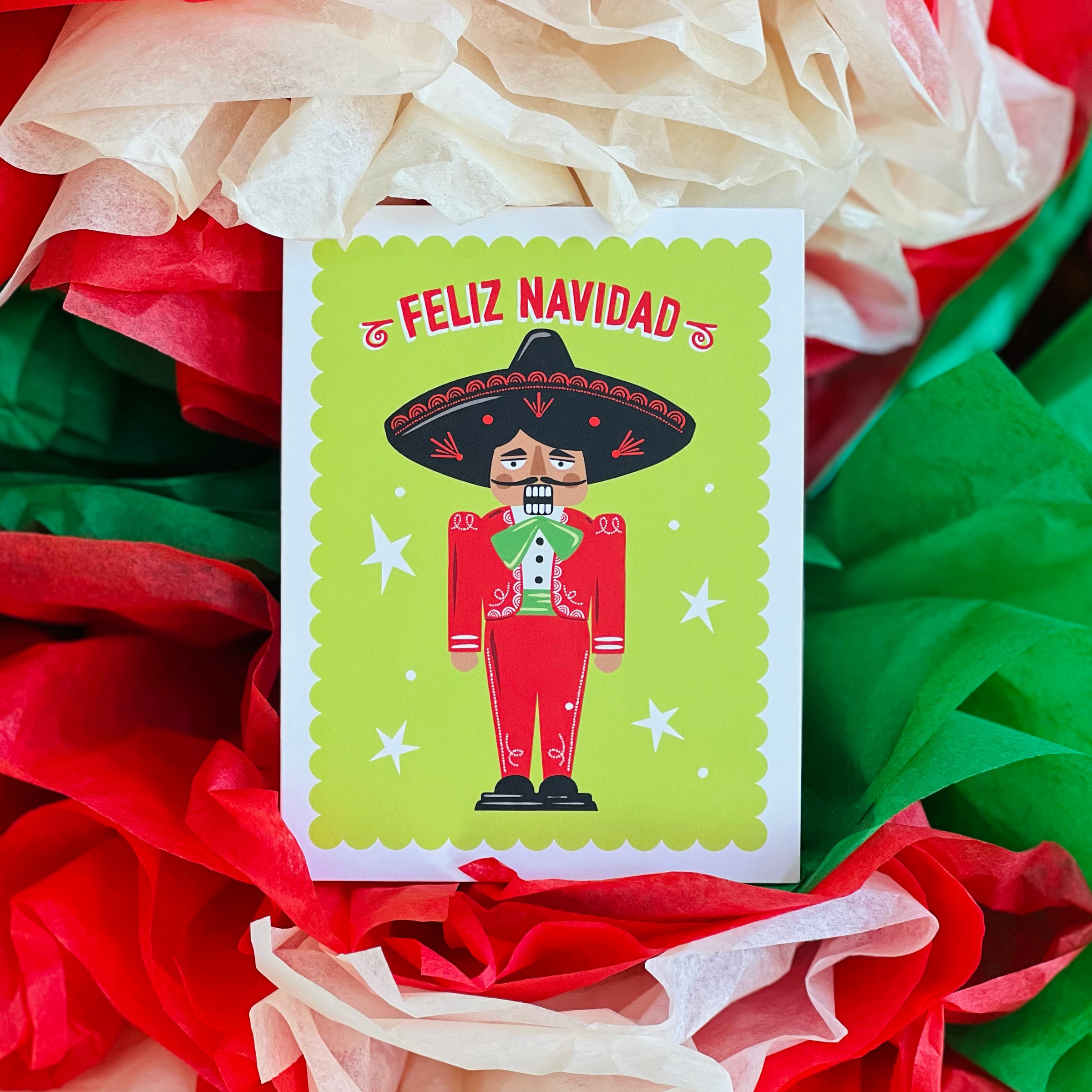 greeting card that reads "Feliz Navidad" & features an illustration of a mariachi nutcracker