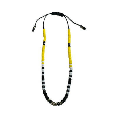 Vibrant Mexican bead bracelet featuring black, yellow, silver and white beads.