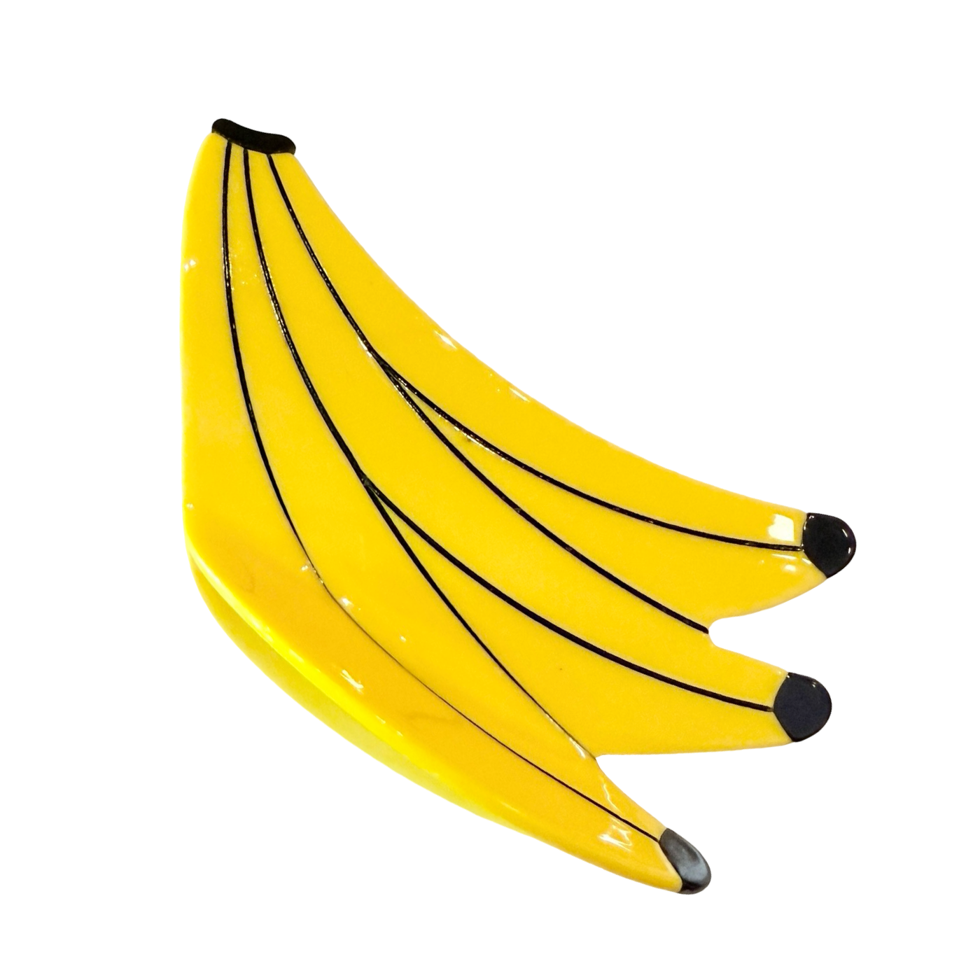 Photo of hair clip resembling 3 ripe yellow bananas