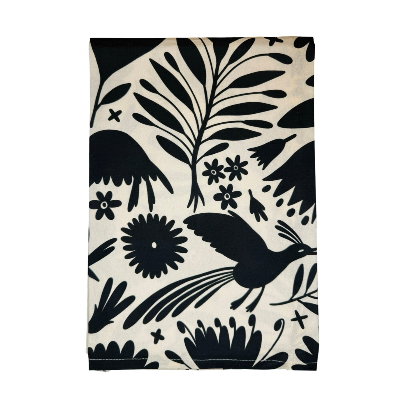 Kitchen towel with black Otomi-inspired designs of birds, flowers, and leaves on a cream background.