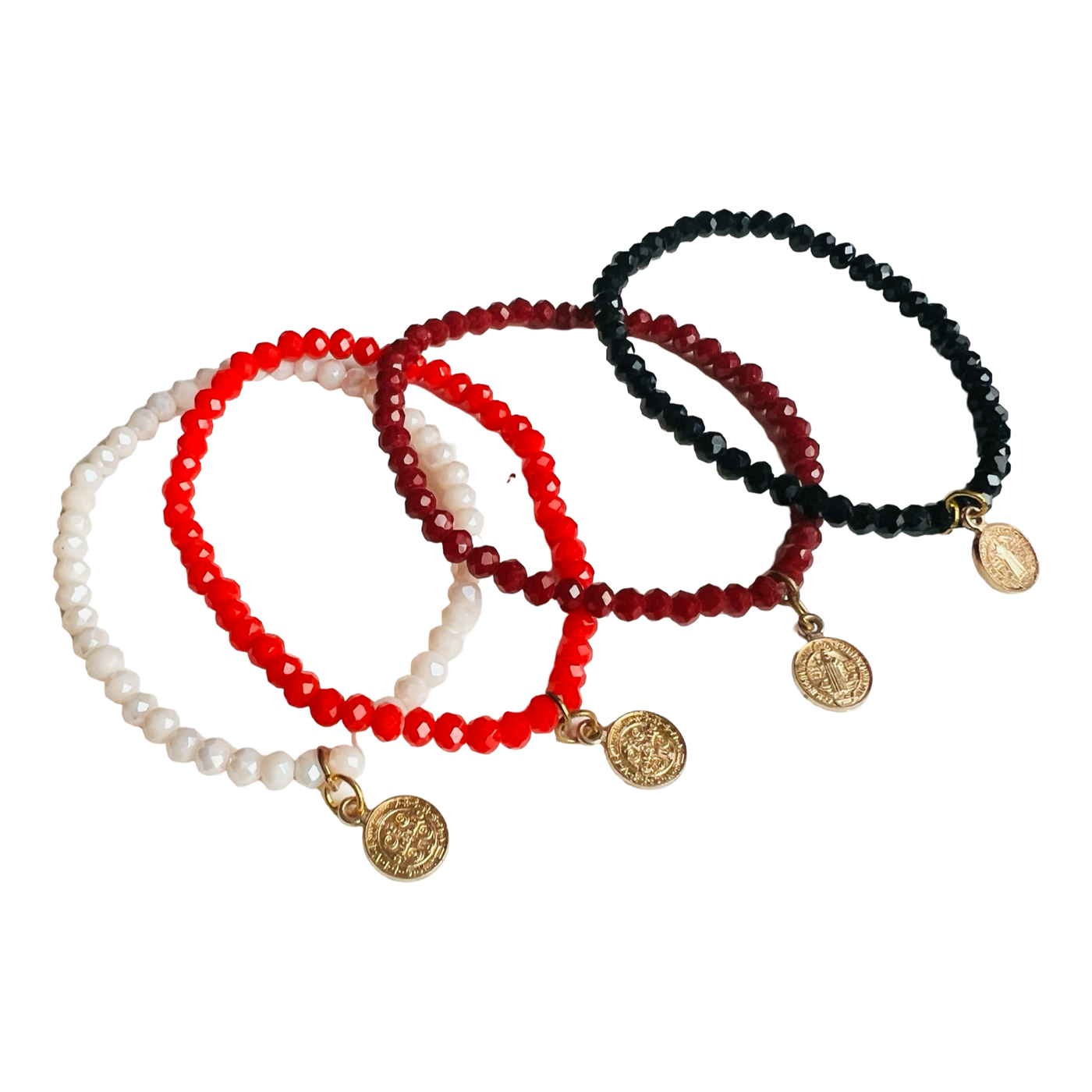 Four colorful bead bracelets in black, red, burgundy and white with faceted beads and a small gold charm hanging from each.