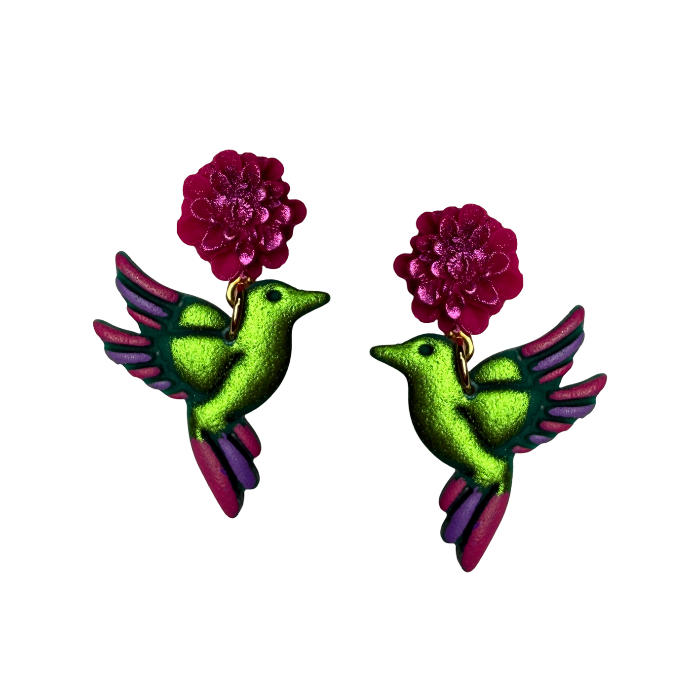 Handpainted earrings with green and purple hummingbird charms dangling from bright pink flower studs.