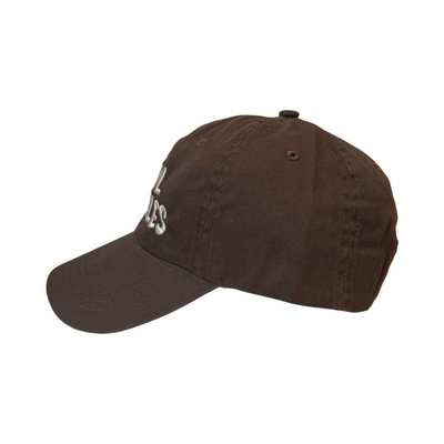 side view of a brown hat with the cool frijoles in tan lettering