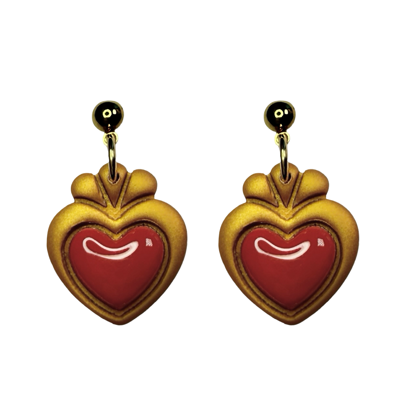 Heart-shaped earrings with gold frames and red centers 