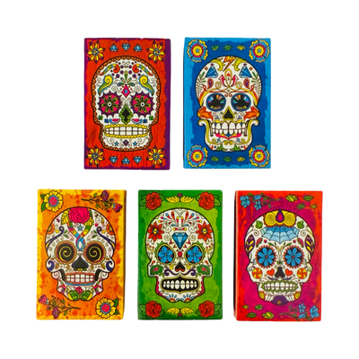 set of 5 colorful mini matchboxes with images of sugar skulls and floral designs.