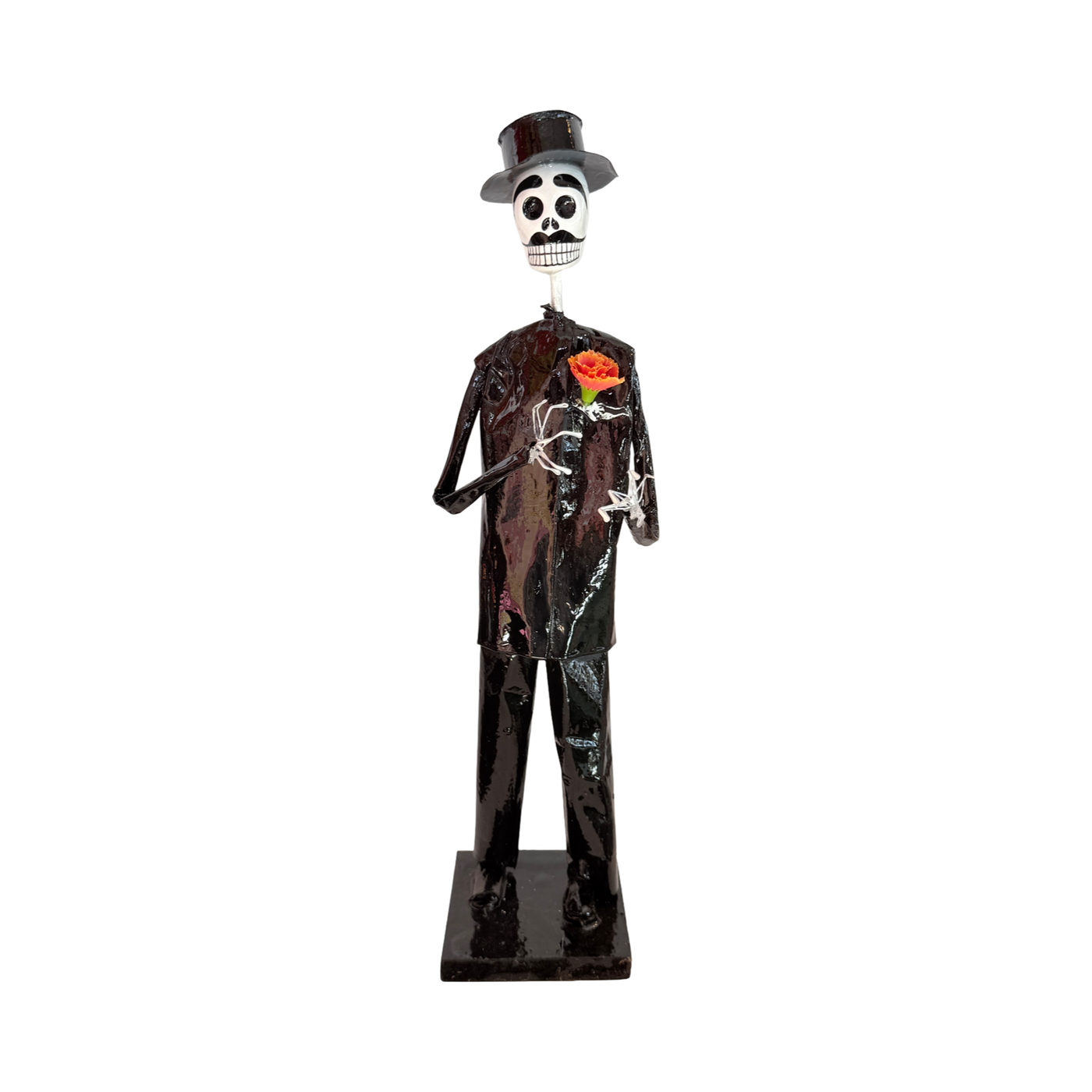Handmade Día de Muertos Catrín figurine crafted from papier-mâché, featuring a skeleton in black clothing with a top hat and marigold flower.