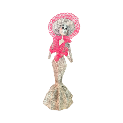 Día de Muertos Catrina figurine in a white gown with black line patterns, adorned with a pink lace collar and wide-brimmed pink lace hat, handmade from papier-mâché.