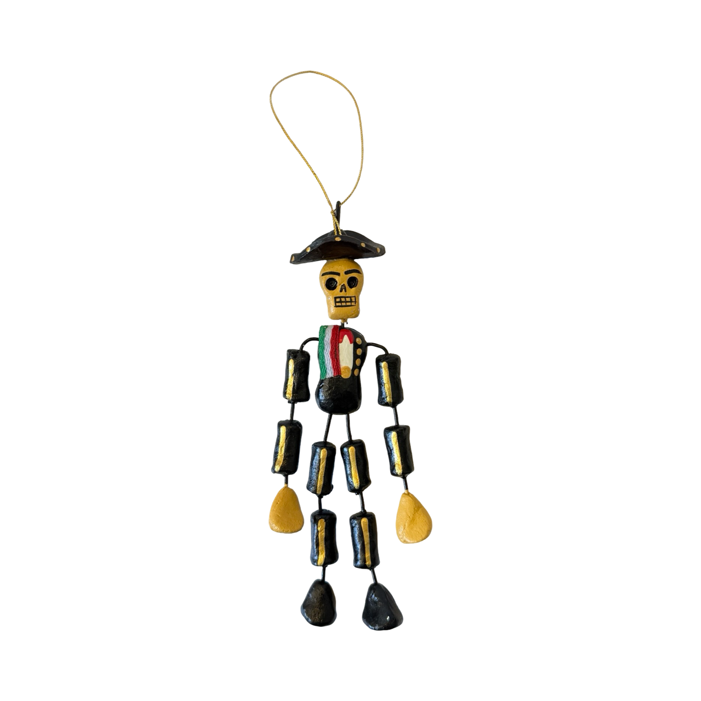 Handcrafted Día de Muertos skeleton ornament wearing a painted black charro outfit with a sombrero and details in red, green, white, and gold.