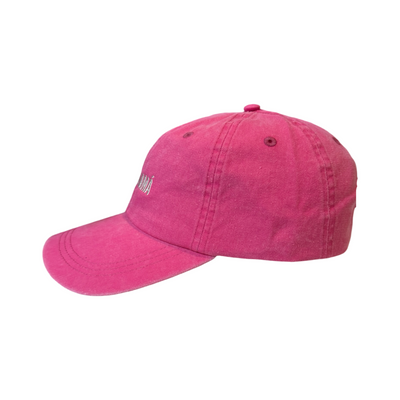 side view of a pink hat with the phrase dog mama in white lettering