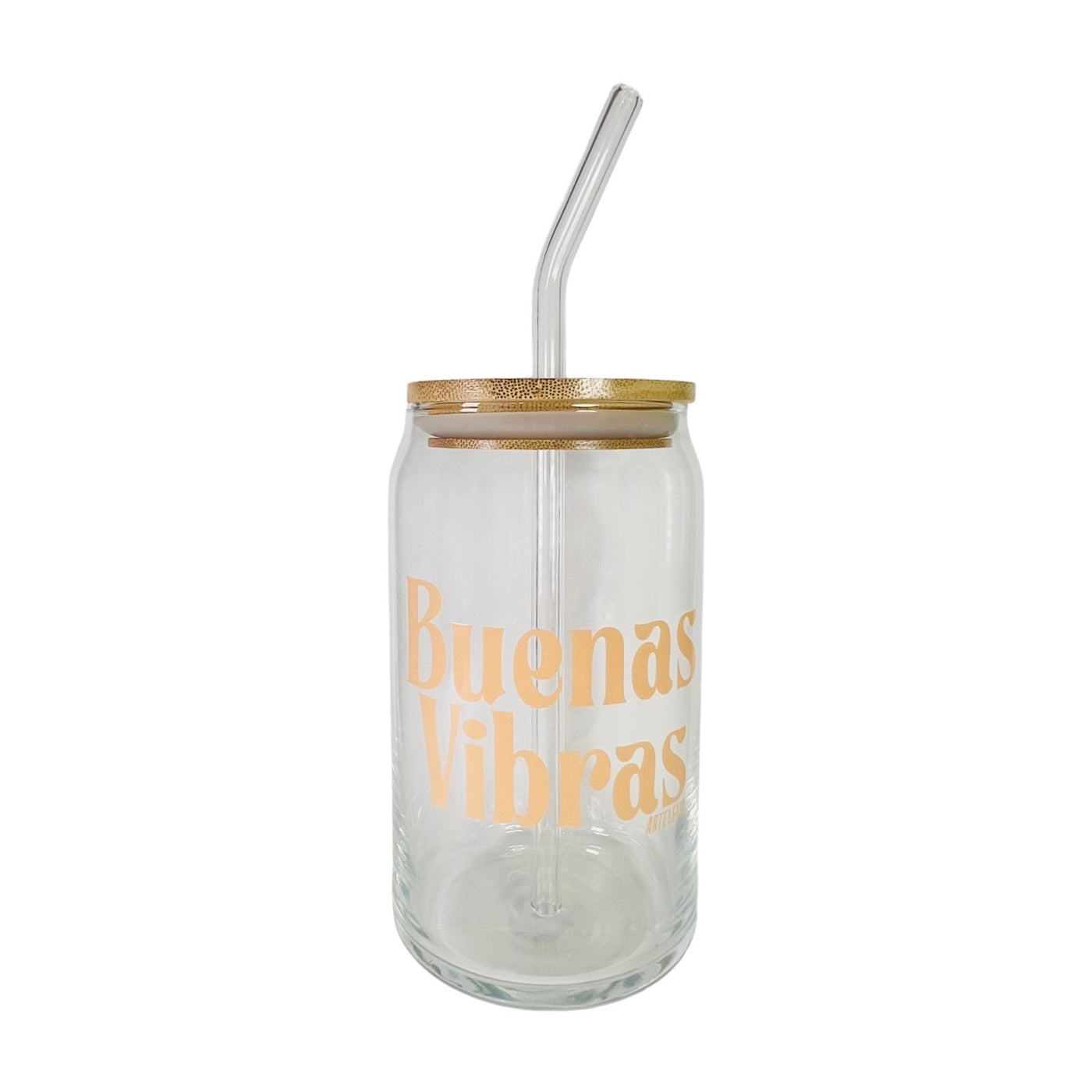 Clear can glass with the phrase Buenas Vibras in light orange lettering featuring a wooden lid and glass straw.